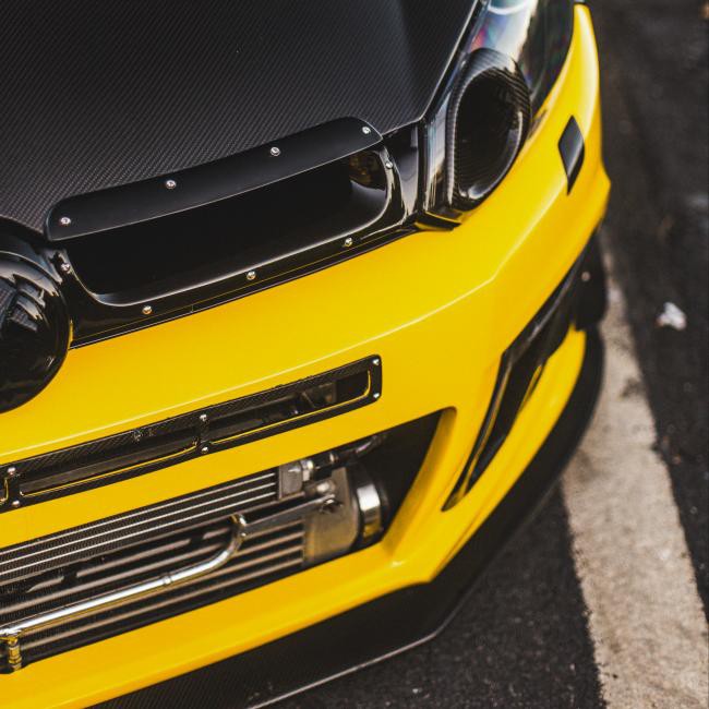 Automotive structural component made with LFT-G® PA66 LCF material Automotive structural component (e.g., high-stress bracket) made with LFT-G® PA66 LCF long carbon fiber nylon